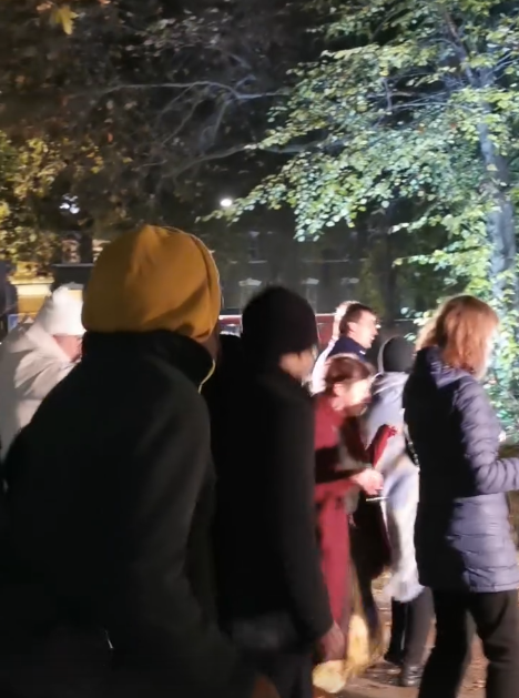 People dancing under trees